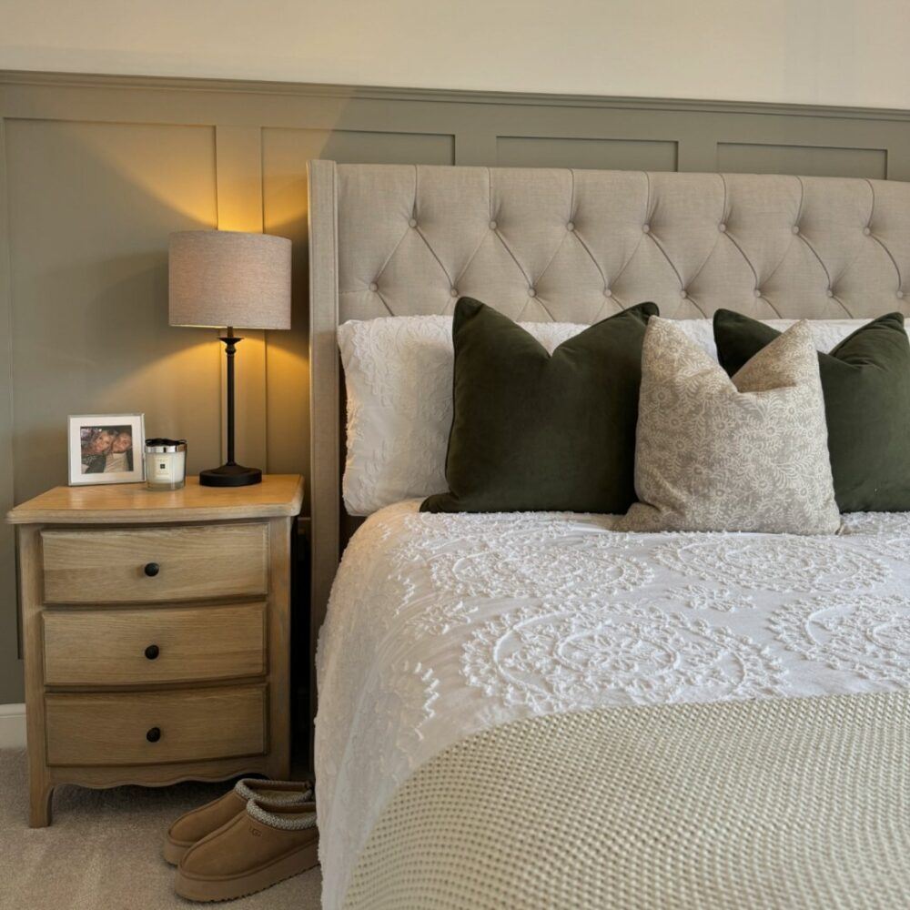 Sage green panelled bedroom
