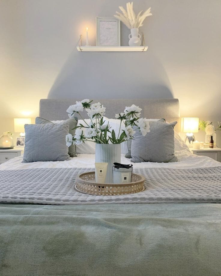 Wilson Upholstered Ottoman Bed in grey with sage and white bedding
